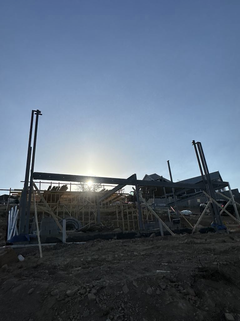 Steel columns silhouetted against the sky at Diamond Creek