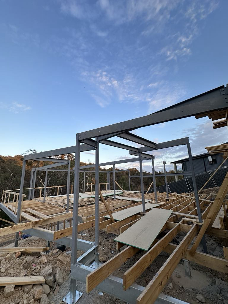 Steel beams spanning the Diamond Creek construction site