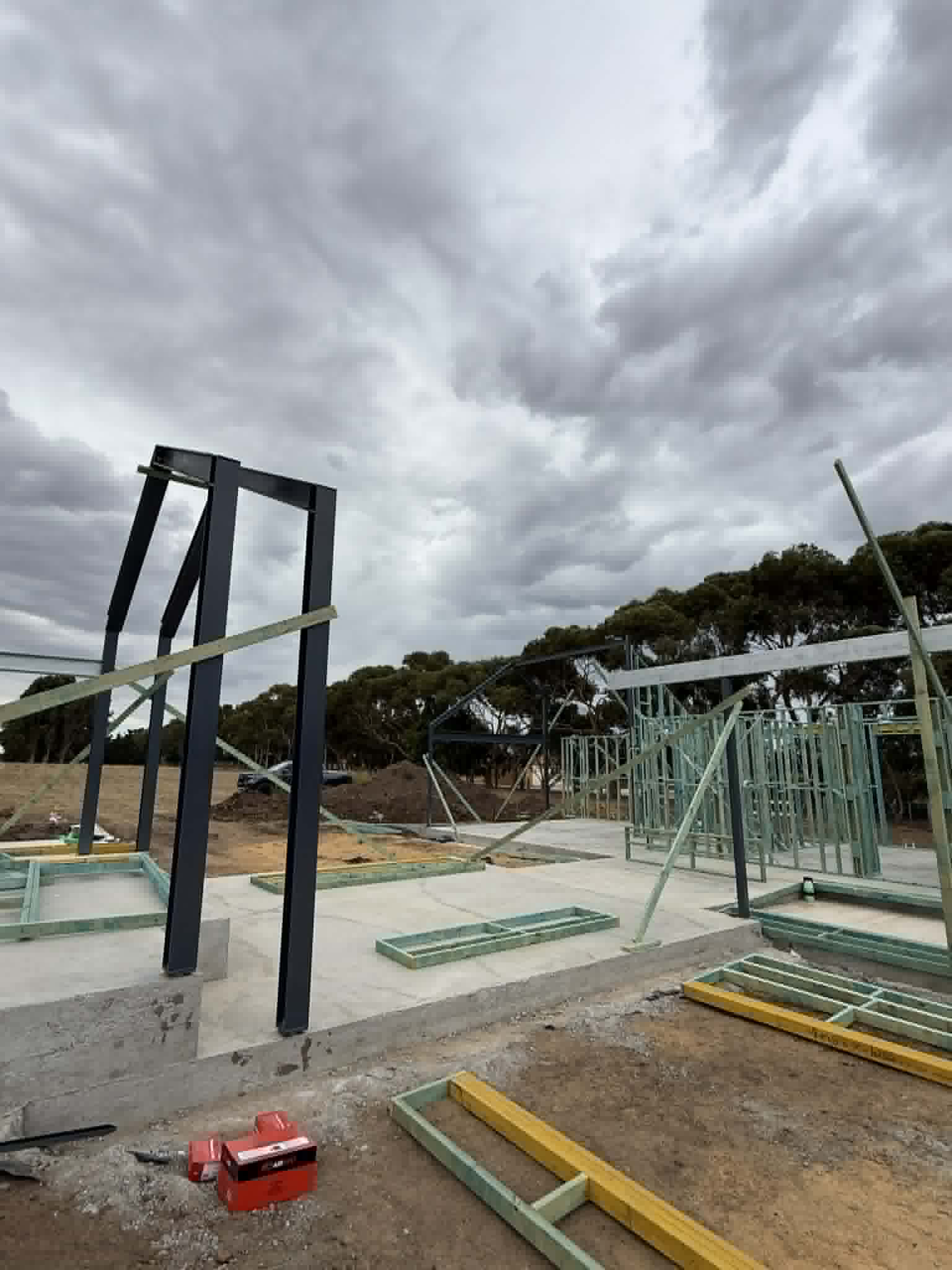 Steel columns and roof beam beside wall framing at Waurn Ponds