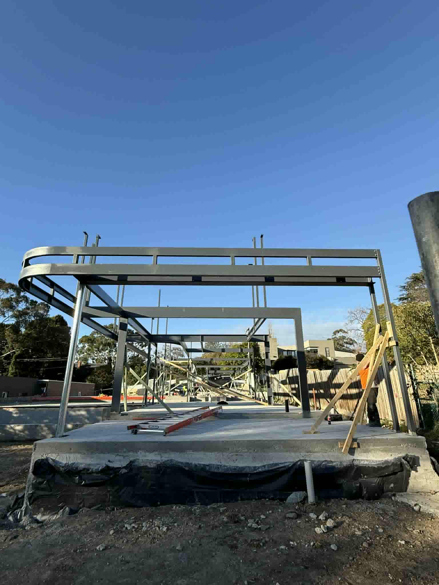 Front view of structural steel beams and columns on the Ivanhoe building site