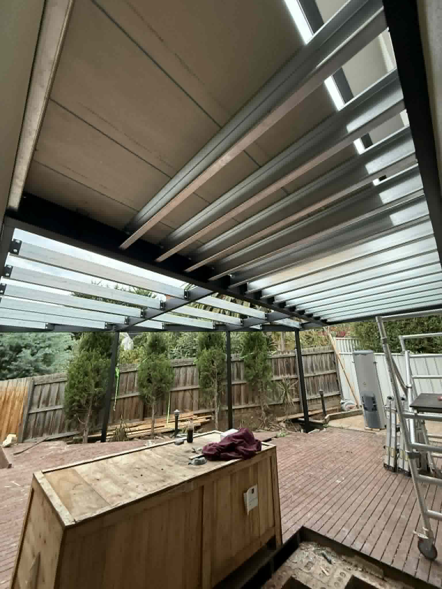 Steel roof beams above a timber deck at Avondale Heights