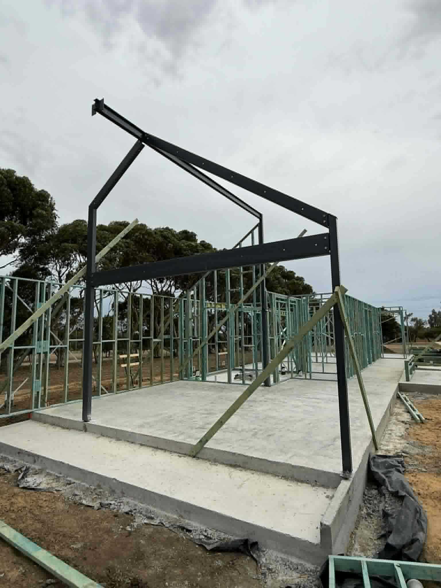 Side view of a steel portal frame and wall framing at Waurn Ponds