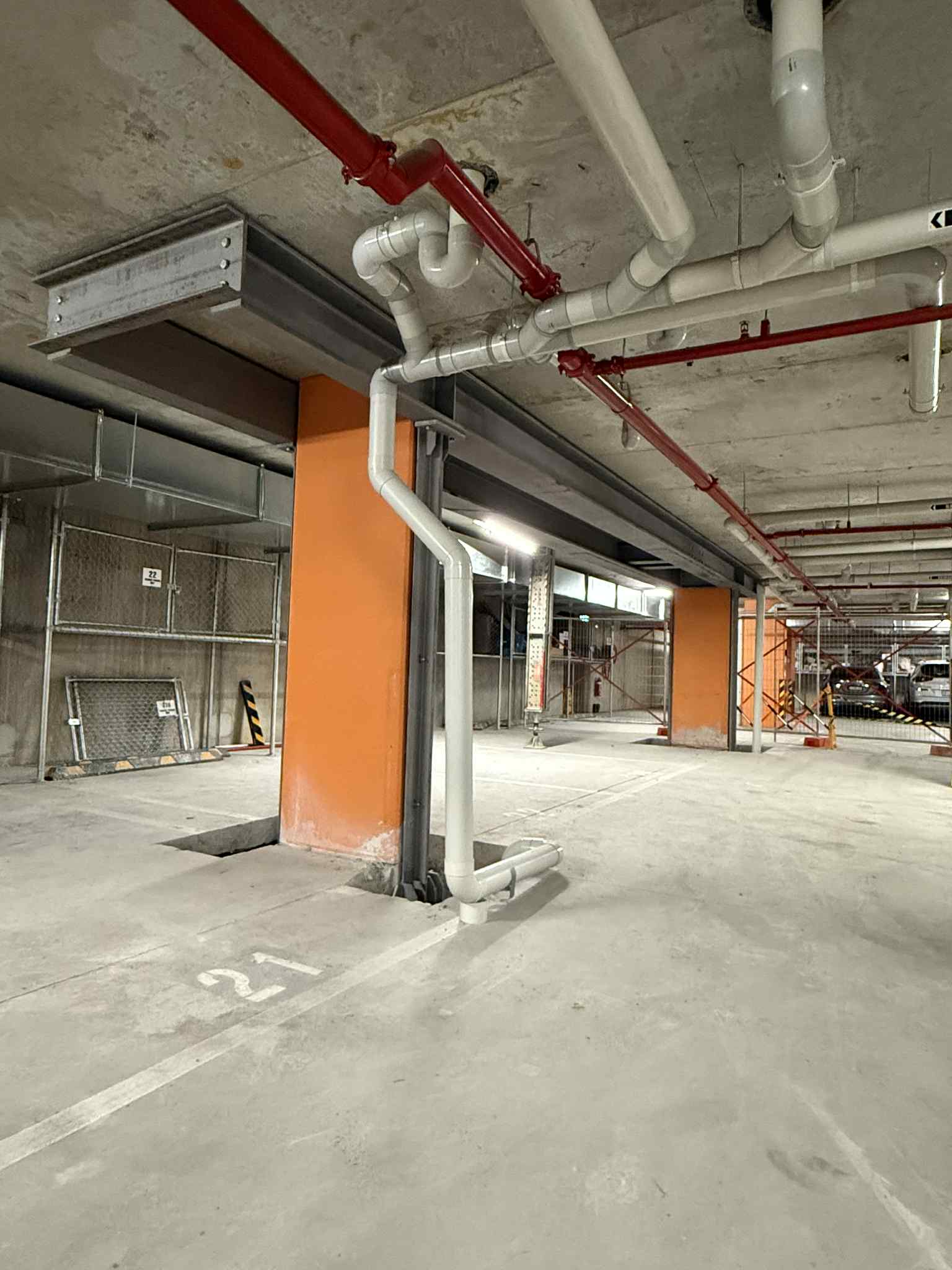 Steel support columns beneath a concrete ceiling at Glen Waverley